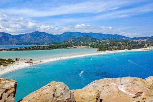 a view of a beach with people in the water at Castello Attic Sunset Terrace in Cagliari