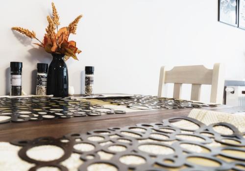 a table with a black and white rug on a table at Dom Gościnny "Zawiśle" in Włocławek