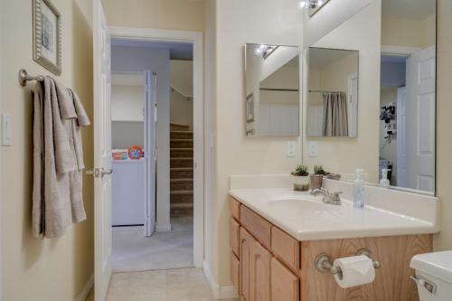 a bathroom with a sink and a mirror at Mesquite Condo with Pool and Spa Access, Near Casinos! in Mesquite