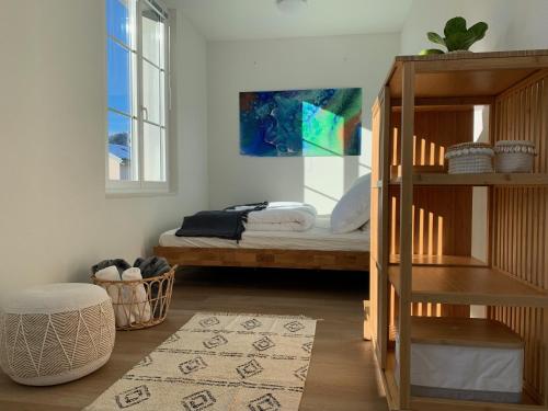 a bedroom with a bunk bed and a ladder and a room with a rug at EVA o Wellnessoasis o Montainview o Pizzaoven o in Ingenbohl