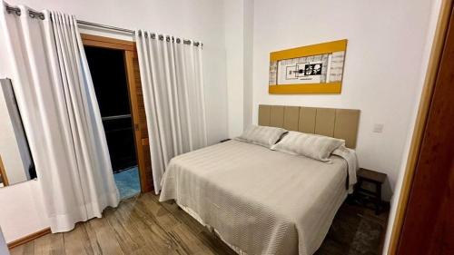 Ένα ή περισσότερα κρεβάτια σε δωμάτιο στο Chales Campestre Monte Verde - 150 mts do Centro