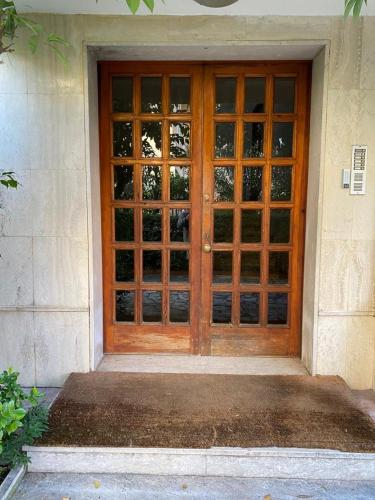 a wooden entry door to a house with at VAGABONDO PETIT MAISON in Caserta