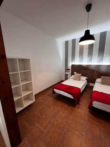 Postel nebo postele na pokoji v ubytování La casa de la avenida