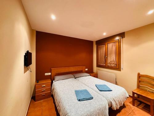 A bed or beds in a room at Pirineos como en casa 2