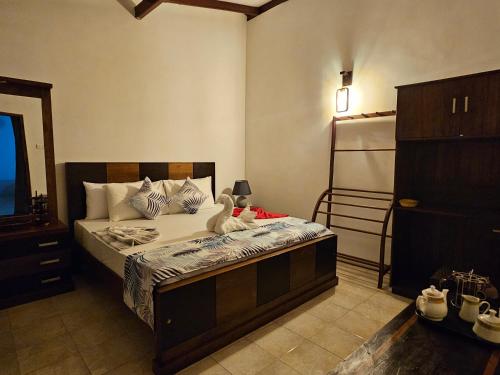 Postel nebo postele na pokoji v ubytování Ellakanda Nature Villa
