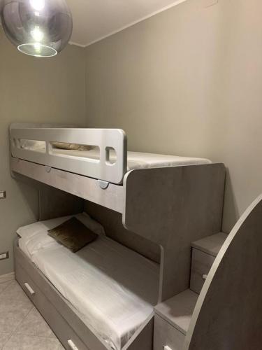 an empty bunk bed in a room at Green Oasis Gabella in Castelforte