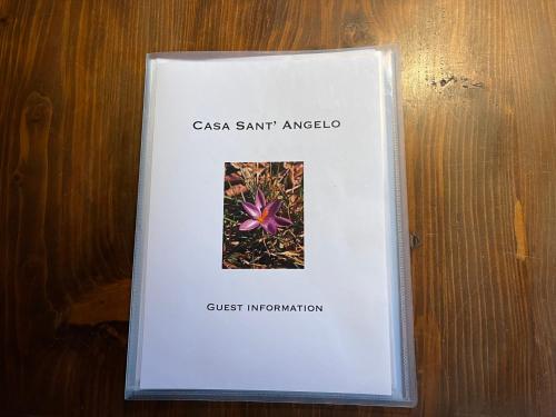 a book with a picture of a csa sant analota at Casa Sant Angelo in Pesaro