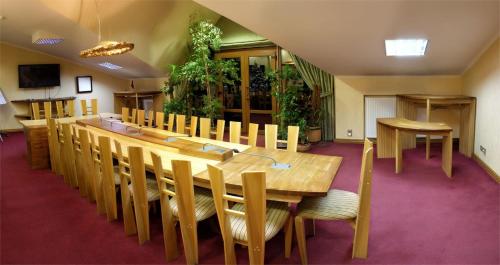 a large conference room with a long table and chairs at Swiss Hotel in Lviv