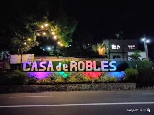 a sign that reads casa de roles at night at Casa de Robles Tanay Rizal in Tanay