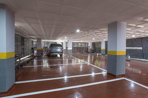 an empty parking garage with a van parked in it at Hotel Centro Stay in Incheon