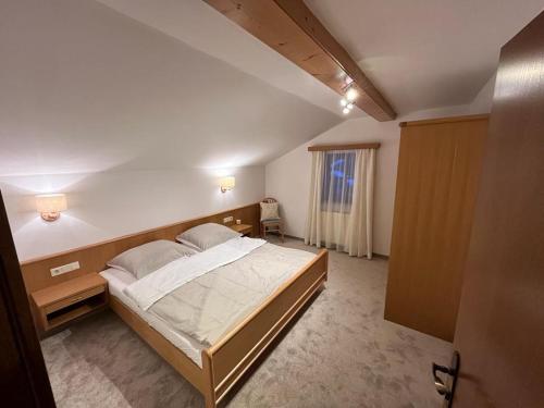 a bedroom with a large bed in a room at Appartement Stahlhammer in Flachau