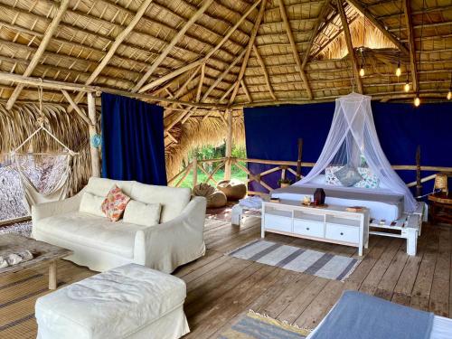 Ένα ή περισσότερα κρεβάτια σε δωμάτιο στο Samana Ecolodge