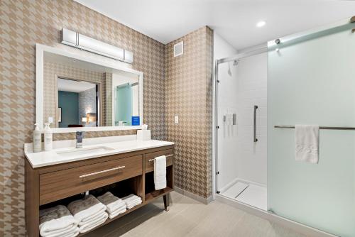 a bathroom with a sink and a shower at Home2 Suites By Hilton San Bernardino in San Bernardino