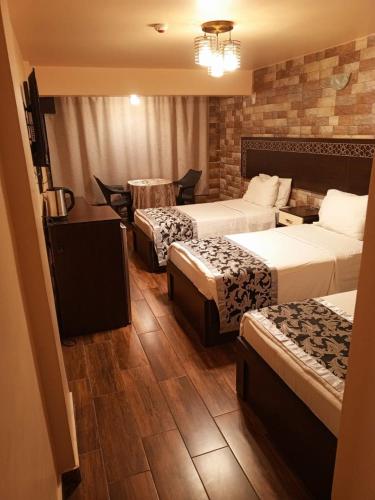 Katil atau katil-katil dalam bilik di Al-Naher Al-Khaled Hotel