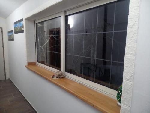 a window in a room with a wooden sill at Bed And Breakfasts LA CASETTA in Terranova di Pollino