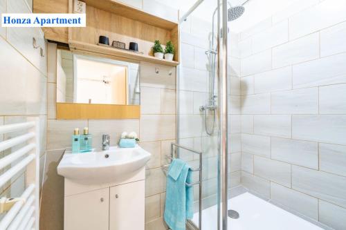 a bathroom with a sink and a shower at O2 Arena - Honza Apartment Praha in Prague