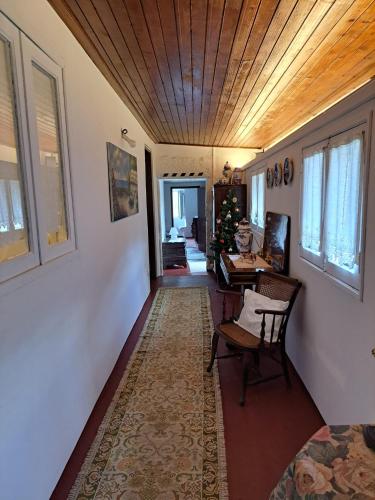 a hallway with a table and a desk in a house at Quinta da Lage Agroturismo e Enoturismo in Celorico de Basto