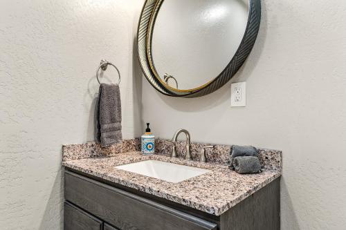 a bathroom with a sink and a mirror at Charming and Tranquil Oasis, Stylish 2 bedroom 1 bathroom Getaway! in Elden Pueblo