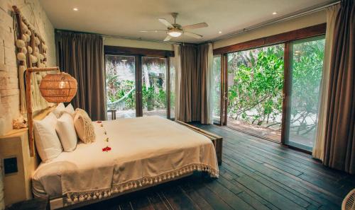 Katil atau katil-katil dalam bilik di Orchid House Tulum Beach