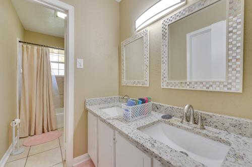a bathroom with a sink and a mirror at Baton Rouge Vacation Rental with Yard 10 Mi to LSU! in Baton Rouge