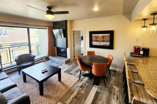 a living room with a couch and a table at Walkable to Mainstreet and Lifts in Park City