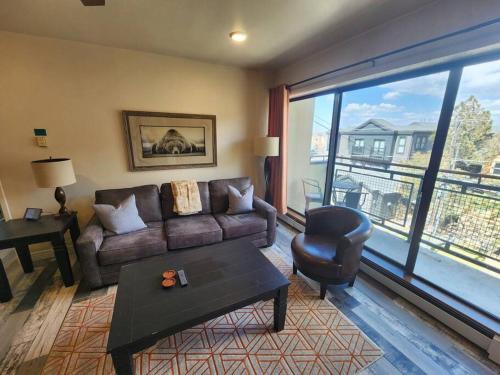 a living room with a couch and a chair at Walkable to Mainstreet and Lifts in Park City
