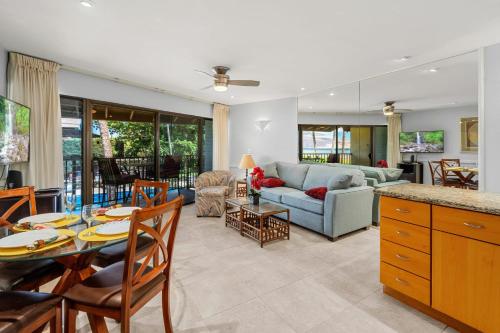 a living room with a couch and a table at WBH D225 Aloha Ola - Ocean and Pool View in Kihei