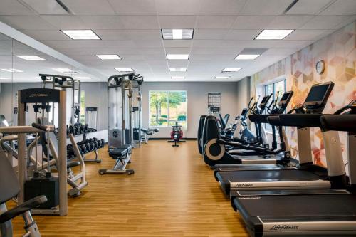 a gym with many treadmills and cardio machines at Hyatt Place Raleigh Cary in Raleigh