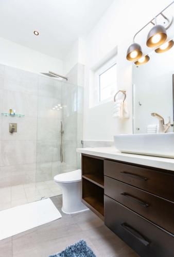 a bathroom with a sink toilet and a shower at Villa Blue Amber Cabarete in Cabarete