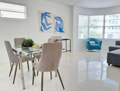 a dining room with a table and chairs at 2 BEDROOM ON THE BEACH ! in Miami Beach