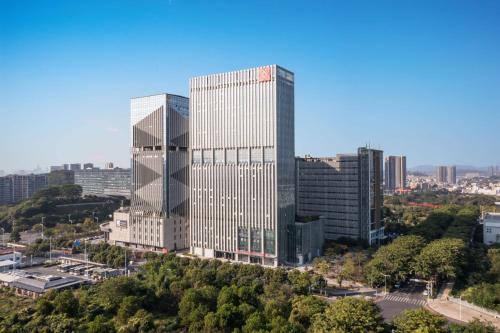 an aerial view of two tall buildings in a city at Hilton Garden Inn Shenzhen Guangming Hongqiao Park in Shenzhen
