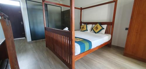 a bedroom with a wooden bunk bed with a rainbow at Kings marine SK town in Matara