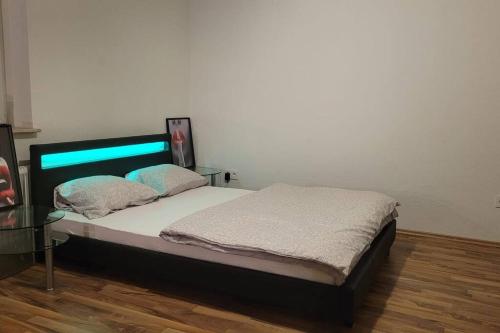 Cama o camas de una habitación en Apartment mit großem Balkon