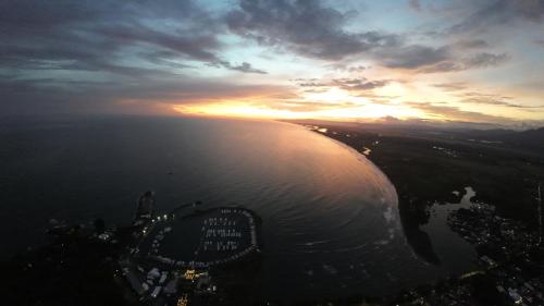 an aerial view of the ocean at sunset at Casa Bella Vista in Quepos
