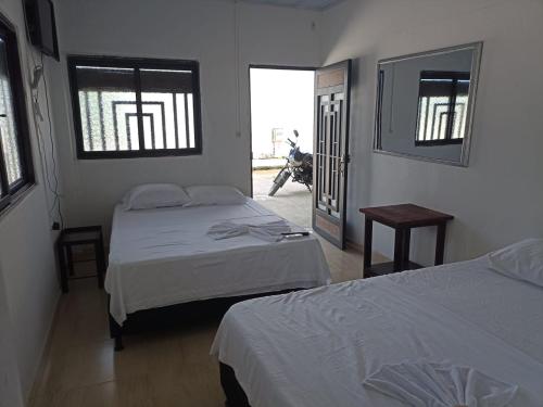Ένα ή περισσότερα κρεβάτια σε δωμάτιο στο Alojamiento la esmeralda