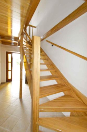 a wooden staircase in a room with a wooden ceiling at Holiday home in Manjadvorci - Istrien 8277 in Manjadvorci