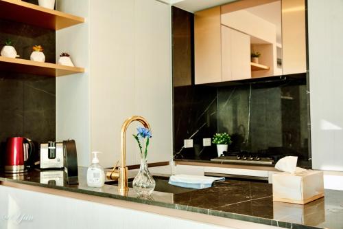 a kitchen with a counter top with a sink at New Year eve’s Fireworks & BayView Apt in CBD in Melbourne
