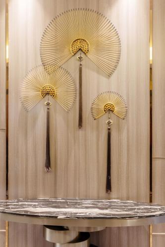 three yellow umbrellas on top of a table at Fortune Land Shenzhen in Shenzhen
