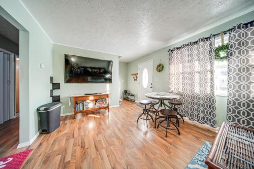 a living room with a table and a tv at Ashtabula Home Rental - 2 Mi to Lake Erie, Beaches in Ashtabula