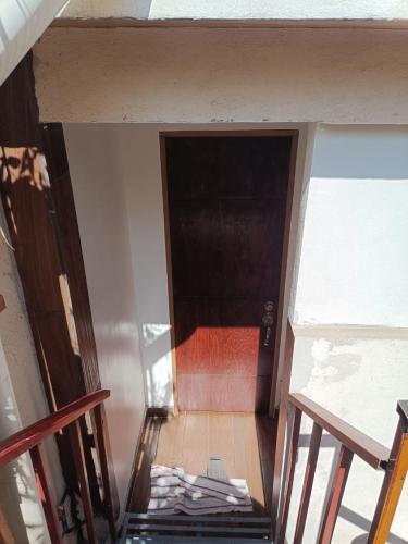 an overhead view of a room with a staircase and a door at Habitacion Amueblada Independiente in Mexico City