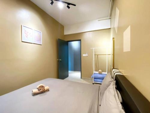 a bedroom with a bed and a hallway with a mirror at JOVIAL Modern Cozy Suite `Metropol BM BandarPerda in Bukit Mertajam