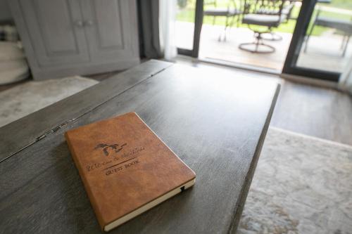 a book sitting on top of a wooden table at The Shores in Williamsburg