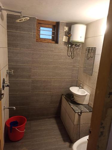 a bathroom with a toilet and a sink at B'camp Resorts & Homestays in Wayanad