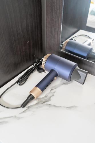 a blue flashlight sitting on top of a table at MIQ HK16, Huay Kwang MRT, 3BR, Pool Table in Ban Zong Katiam