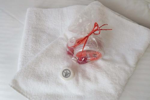 a white napkin with a glass object on it at Horský pension Gendorf in Cerny Dul