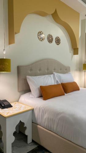 Cama o camas de una habitación en Amman Trail Hotel & Studios