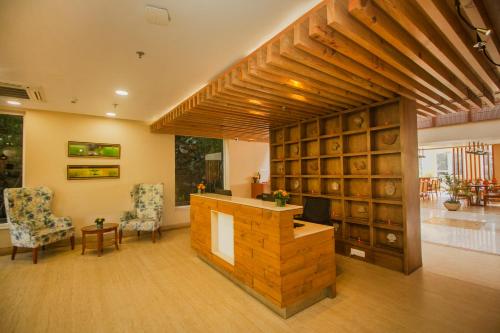 a large room with a wine cellar with two chairs at Yog Wellness Resort & Spa By Amritara in Mussoorie