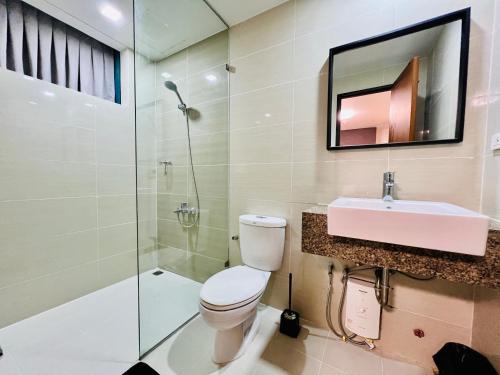 a bathroom with a toilet and a sink and a shower at Executive Queen 1BR Luxury Suite 10 - Pool, Wi-Fi in Manila