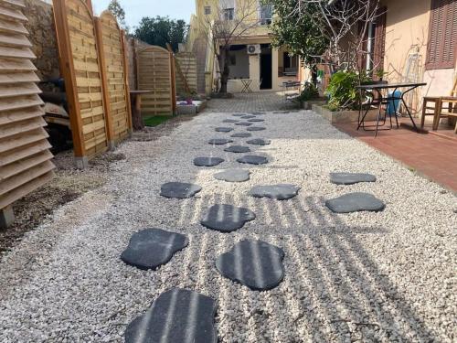 a group of stepping stones on a gravel road at la coquine, love room, romantique in Toulon