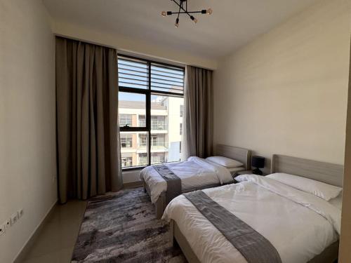 Postel nebo postele na pokoji v ubytování 2BR Mulberry - Park View - Spacious